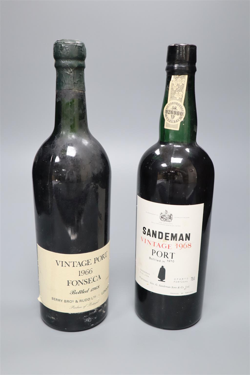 Two bottles of vintage port; Fonseca 1966 and Sandeman 1968